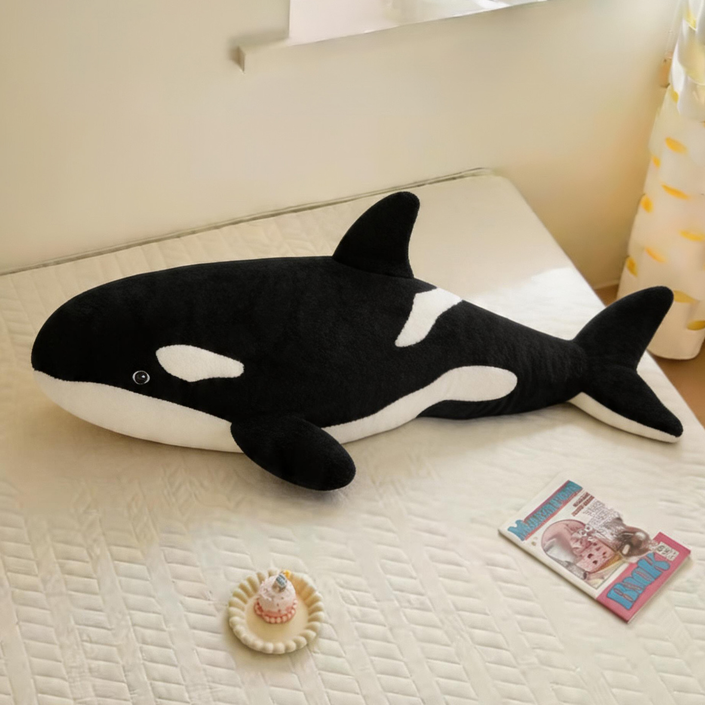 Orca Killer Whale plush pillow on a bed, perfect for hugging, sleeping, and adding cozy ocean-inspired bedroom decor