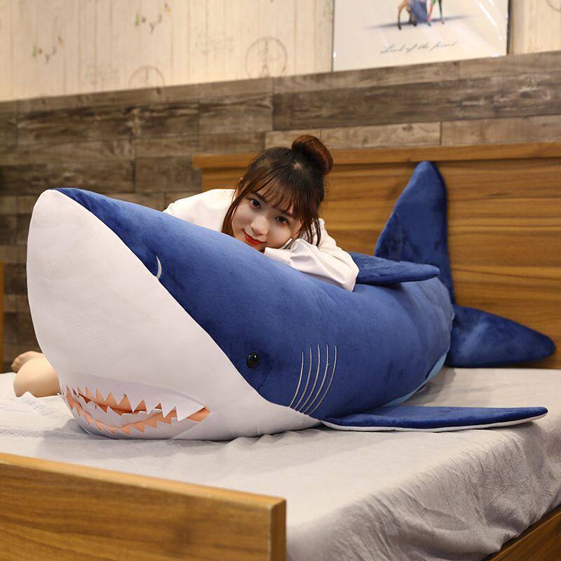 Megalodon Shark Plush Toy creating a cozy bedroom scene, perfect for hugging, relaxing, and display