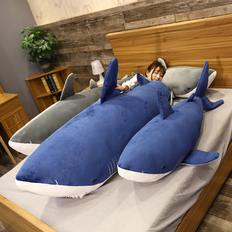 Megalodon Shark Plush Toys arranged on a bed, creating a cozy bedroom scene for hugging and decorating