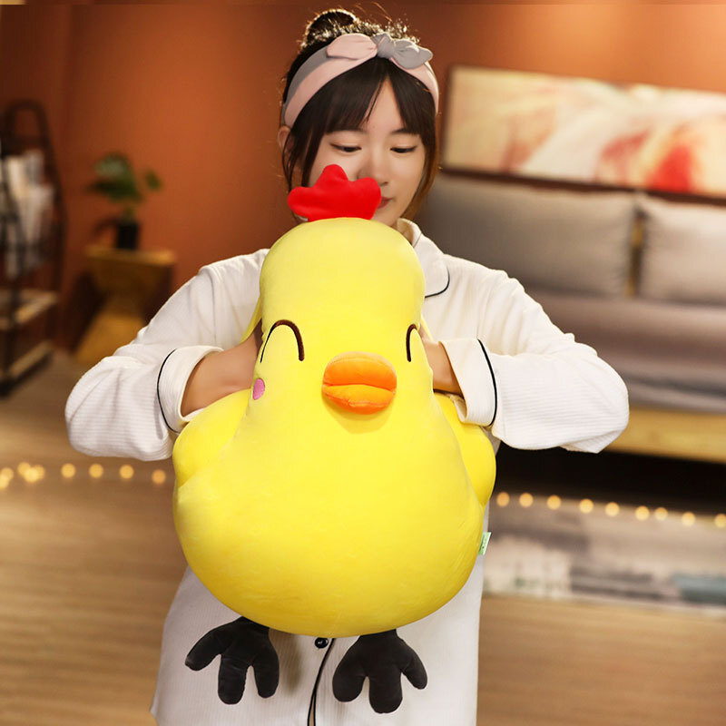 Funny Yellow Chick Plush Toy with Happy Eyes expression gently squeezed to highlight its soft plush filling
