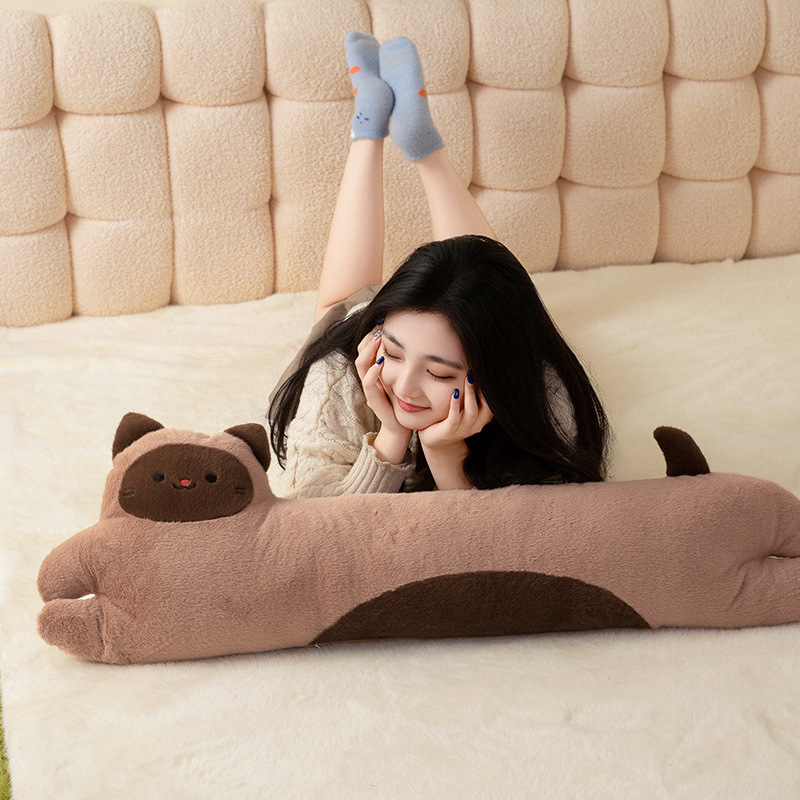 Siamese Cat Long Plush Pillow placed on a cozy bed, featuring a soft elongated design for hugging, lounging, sleeping, and everyday comfort
