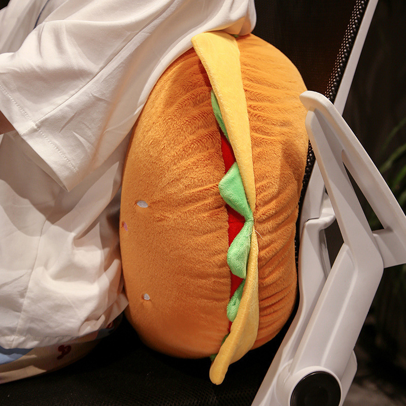 Burger Plush Pillow providing comfortable back support while sitting at a desk