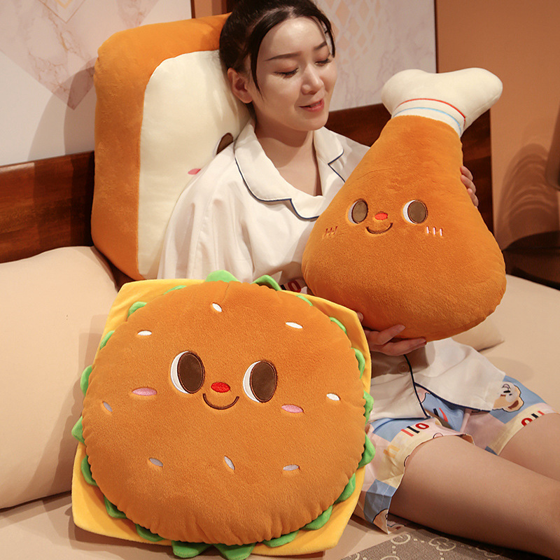 Chicken Drumstick and Burger Plush Pillows with a Toast Plush Pillow used as a cozy back cushion