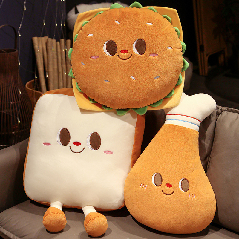 Burger, Toast and Chicken Drumstick Plush Pillows displayed together on a cozy sofa