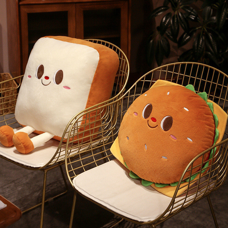 Burger and Toast Plush Pillows placed on lounge chairs as playful home decor