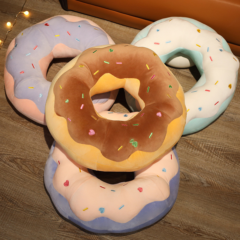 Sweet Donut Plush Pillows in Raspberry, Taro, Sea Salt, and Chocolate designs displayed together