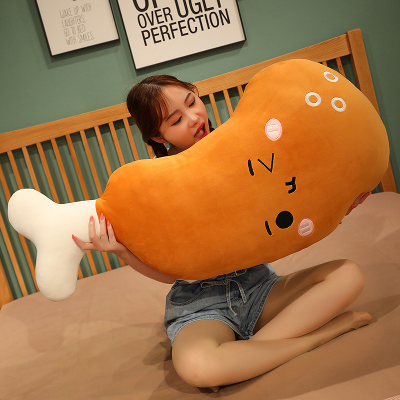 Winking Chicken Drumstick Plush Pillow showing its long body design, perfect for hugging, lounging, reading, and everyday relaxation