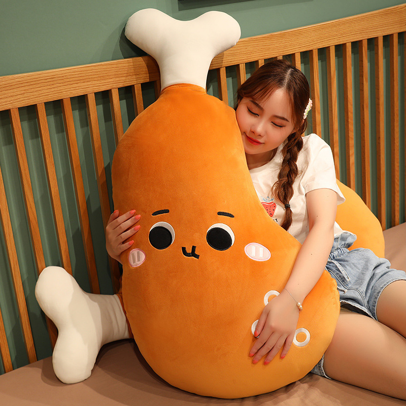 Round Eyes Chicken Drumstick Plush Pillow used as a soft hugging pillow for relaxing, lounging, and cozy bedroom comfort