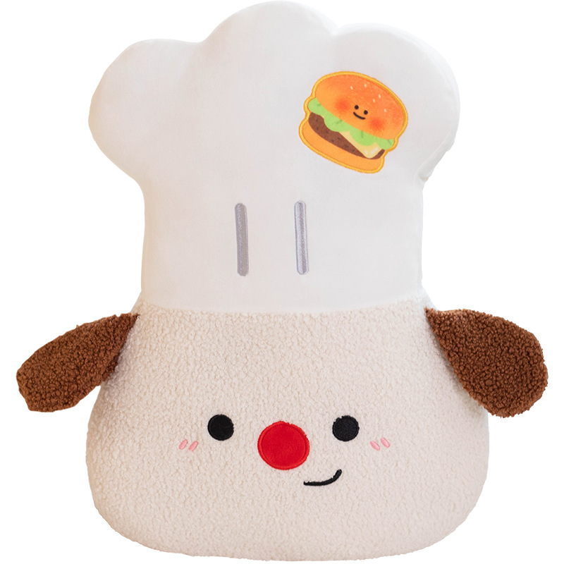 Chef Dog plush pillow with a soft white chef hat, embroidered burger patch, fluffy plush fabric, and cute embroidered face