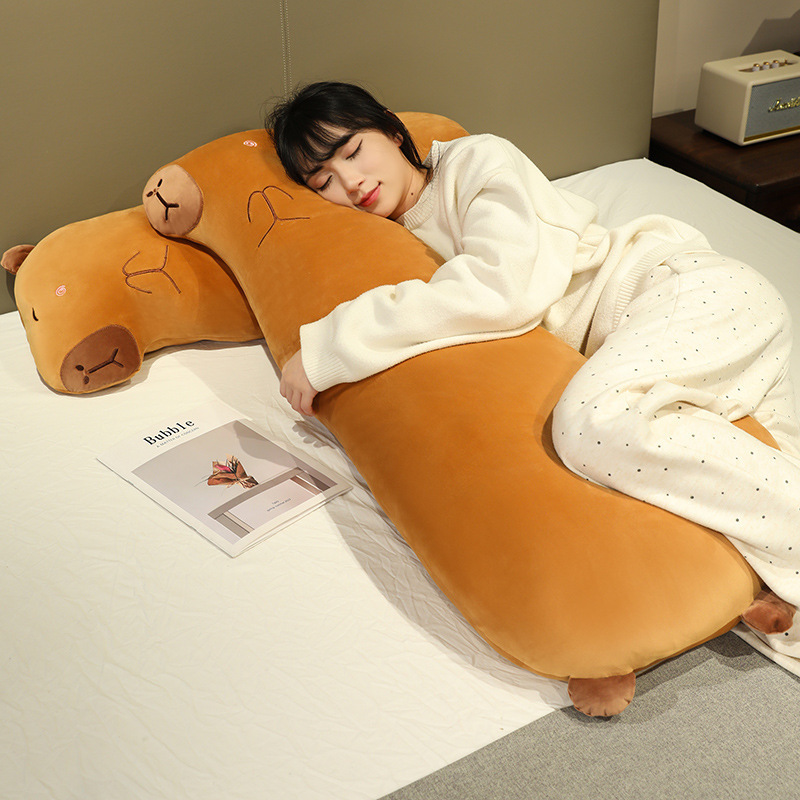 Capybara Long Plush Pillow providing cozy full-body support for hugging, lounging, resting, or taking a nap in bed
