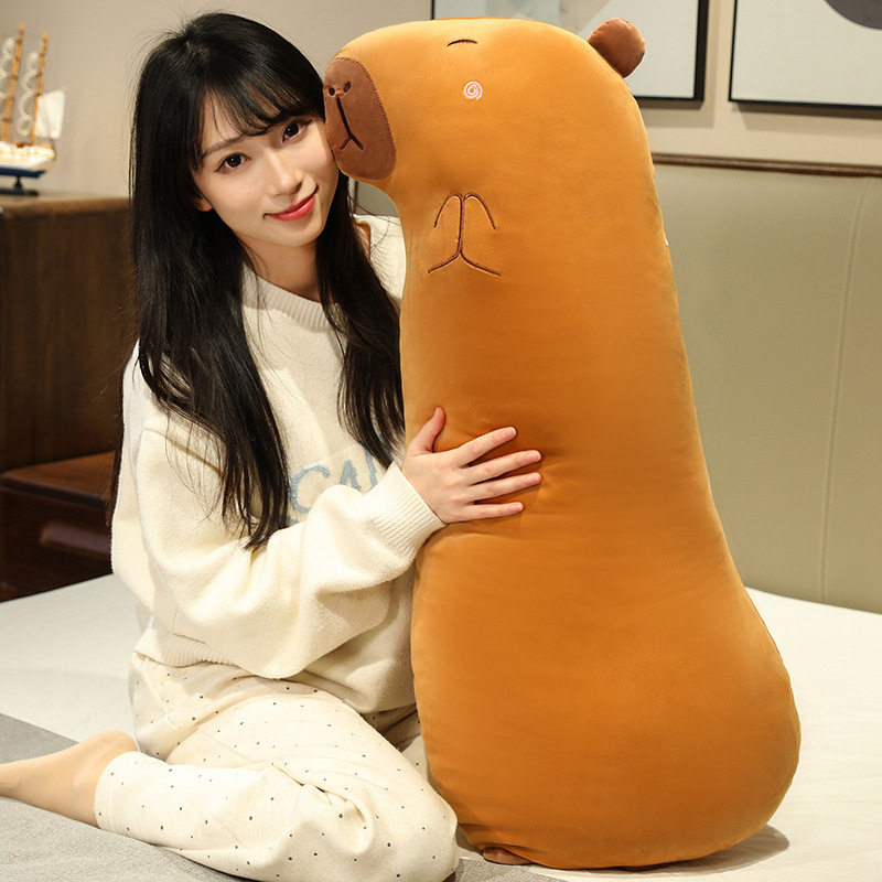 Capybara Long Plush Pillow shown as a cozy body pillow for hugging, highlighting its soft plush fabric and long huggable design