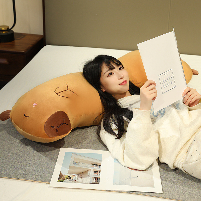Capybara Long Plush Pillow used as a soft back and neck support pillow for reading, relaxing, and creating a cozy bedroom atmosphere
