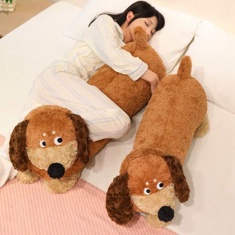 Dachshund Plush Pillow used for cuddling during rest, featuring a long dog design, soft plush fabric, fluffy PP cotton filling, and a cozy bedroom setting