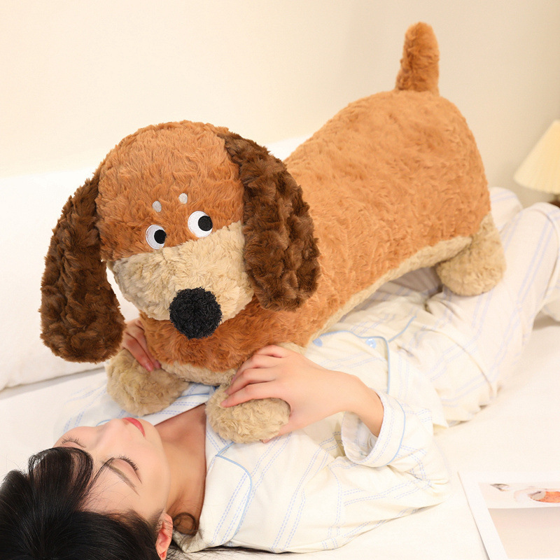 Dachshund Plush Pillow used as a cozy cuddle pillow, featuring a long dog design, soft plush fabric, floppy ears, and fluffy PP cotton filling