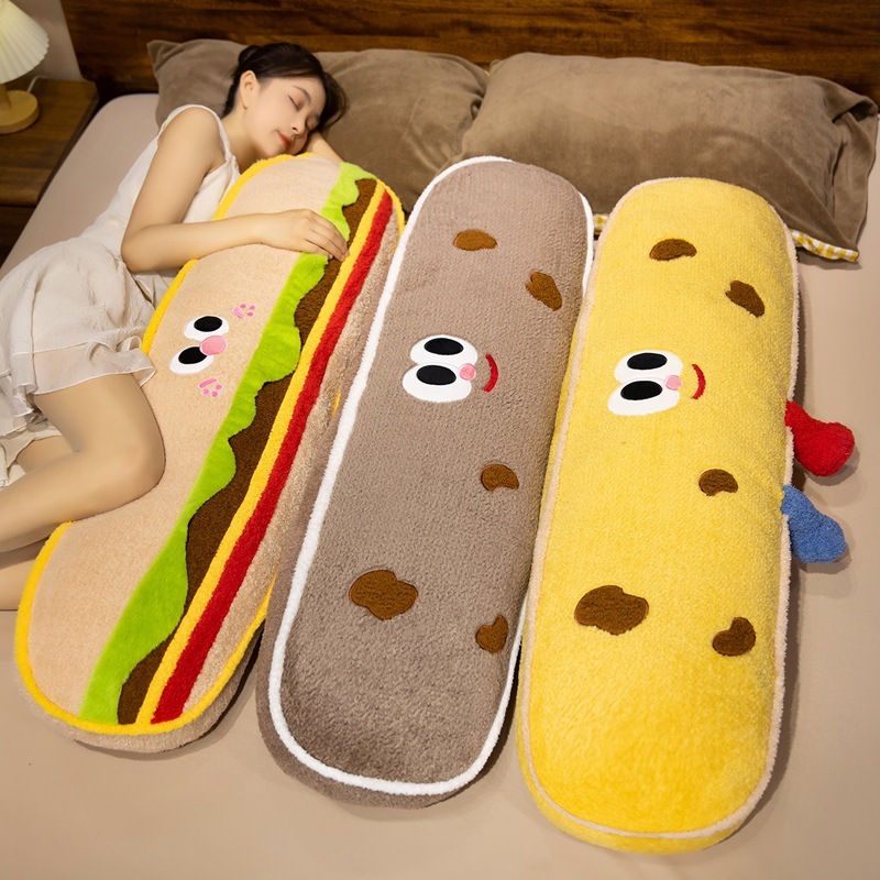 Hamburger and cookie plush pillows used for hugging and sleeping, bringing soft comfort to bedtime, lounging, and relaxing in a cozy bedroom