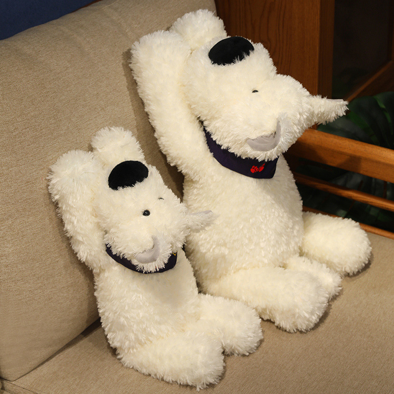 Two Bandana Dog Plush Toys sitting on a sofa, showcasing their fluffy white plush, oversized noses, soft bandanas, and adorable puppy design