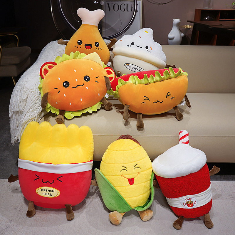 Hamburger, Hot Dog, French Fries, Chicken Drumstick, Ice Cream, Cola & Corn Plush Pillows displayed together, showcasing adorable food-inspired designs for cozy home decor