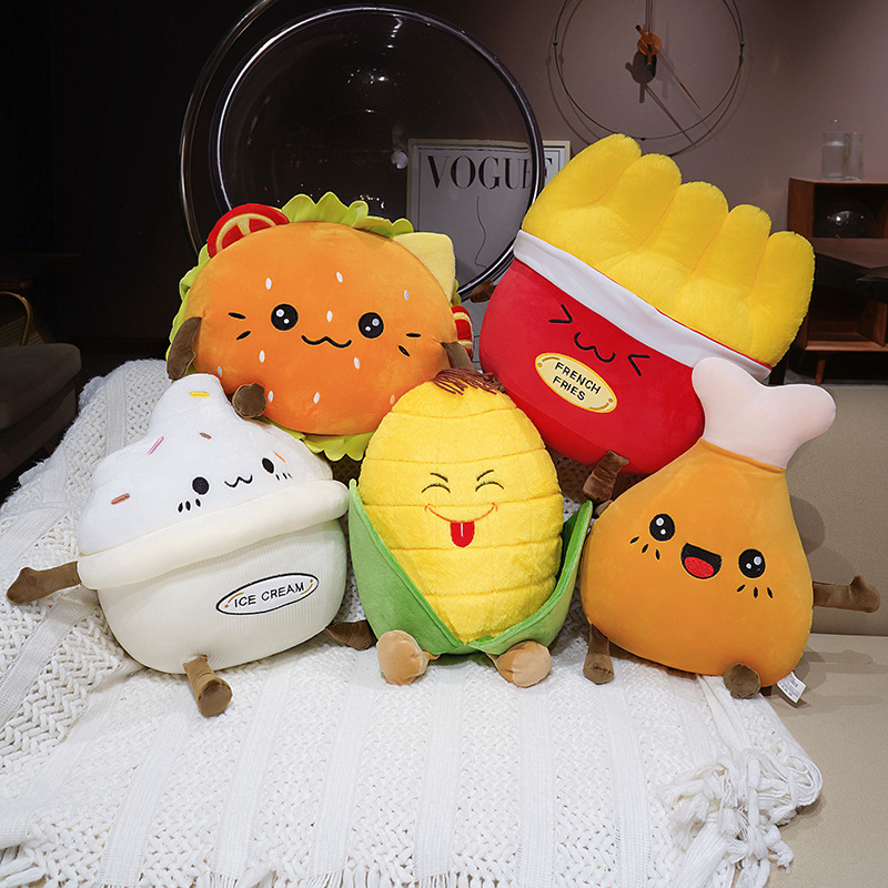 Hamburger, French Fries, Ice Cream, Corn, and Chicken Drumstick Plush Pillows displayed together, showcasing adorable food-inspired designs for cozy home decor