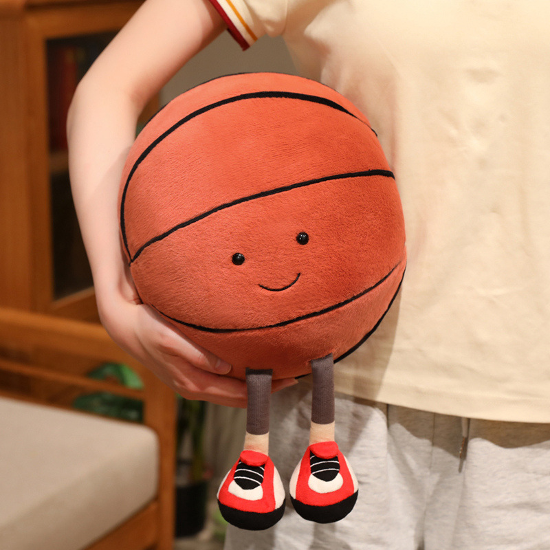 Basketball Plush Toy with a cute smiling basketball design and adorable dangling legs, soft and comfortable for hugging, cuddling, or carrying around