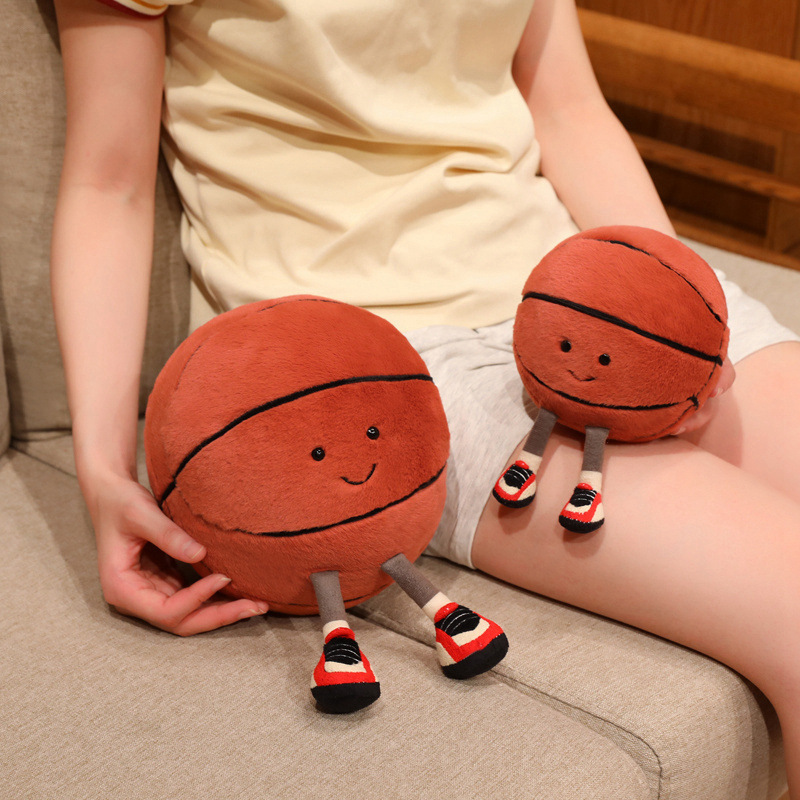 Basketball Plush Toy in multiple sizes with a cute smiling basketball design, ideal for decorating sofas, relaxing, and adding a playful touch to any room