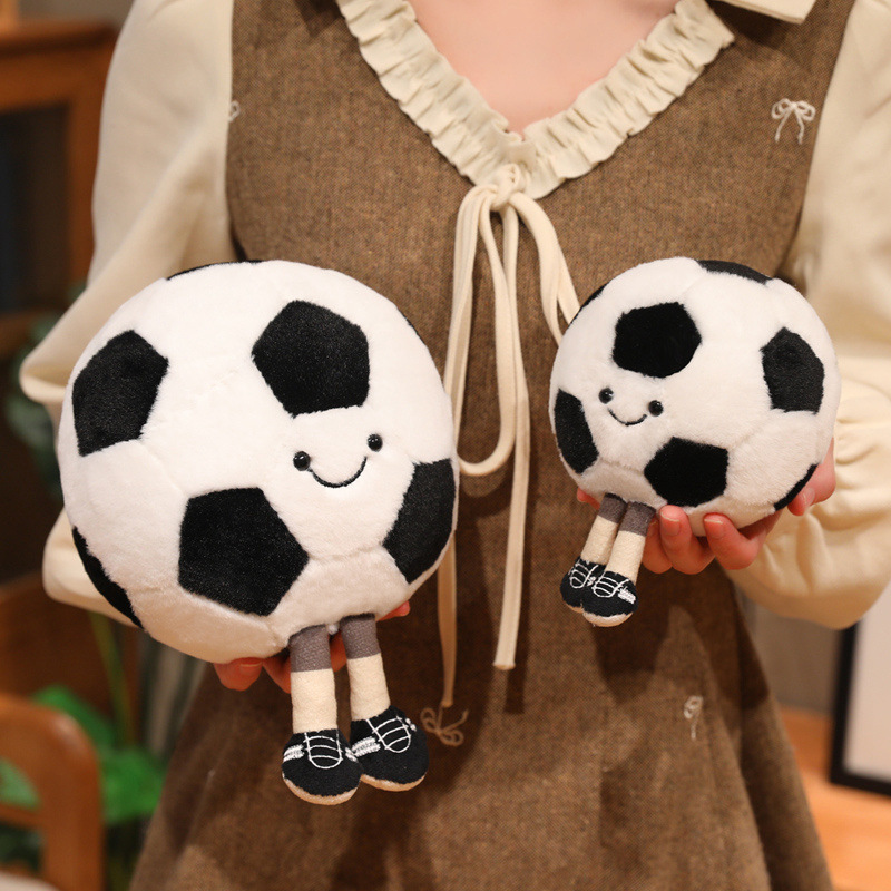 Soccer Ball Plush Toys in two sizes featuring smiling faces, soft plush fabric, and cute dangling legs