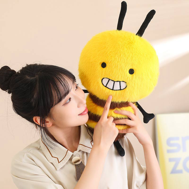 Bee Plush Toy with a cheerful embroidered smile, soft plush fabric, fluffy striped body, and tiny wings, creating a cute and comforting display
