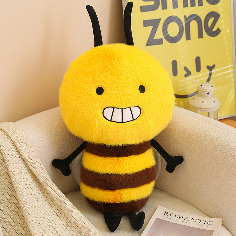 Bee Plush Toy with a smiling bumblebee design, fluffy striped body, tiny wings, and soft plush fabric, displayed on a chair for cozy home decor