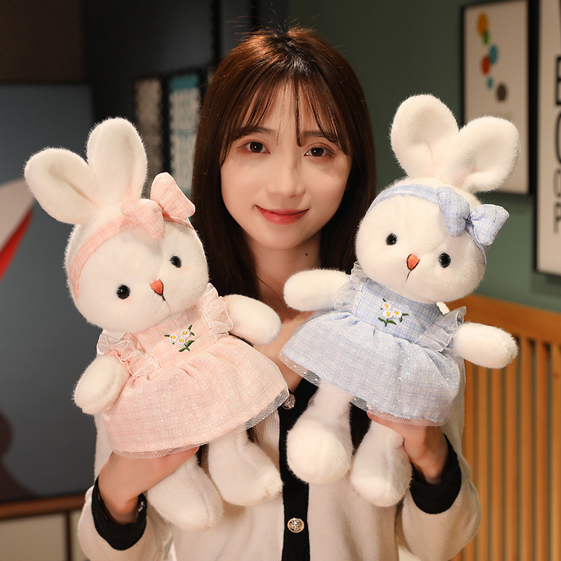 Cute Bunny Plush Toys in blue and pink featuring embroidered daisy dresses, matching bow headbands, and soft plush fabric for cuddling or display