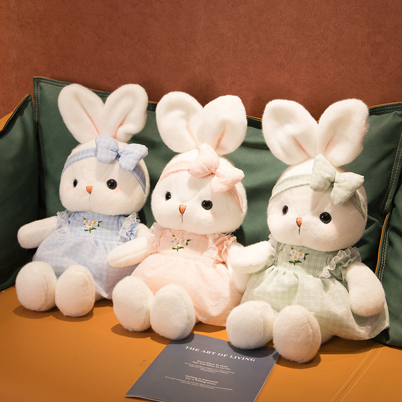 Cute Bunny Plush Toys in blue, pink, and green featuring soft plush fabric, embroidered daisy dresses, and matching bow headbands for a charming decorative display