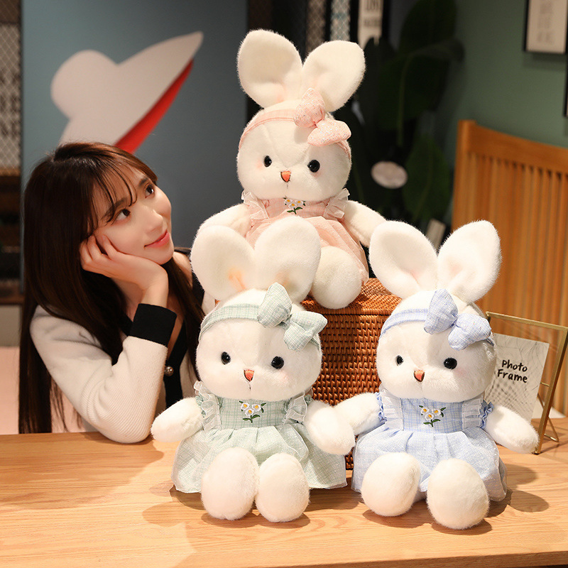 Cute Bunny Plush Toys in blue, pink, and green create a charming decorative display with embroidered daisy dresses, matching bow headbands, and soft plush fabric