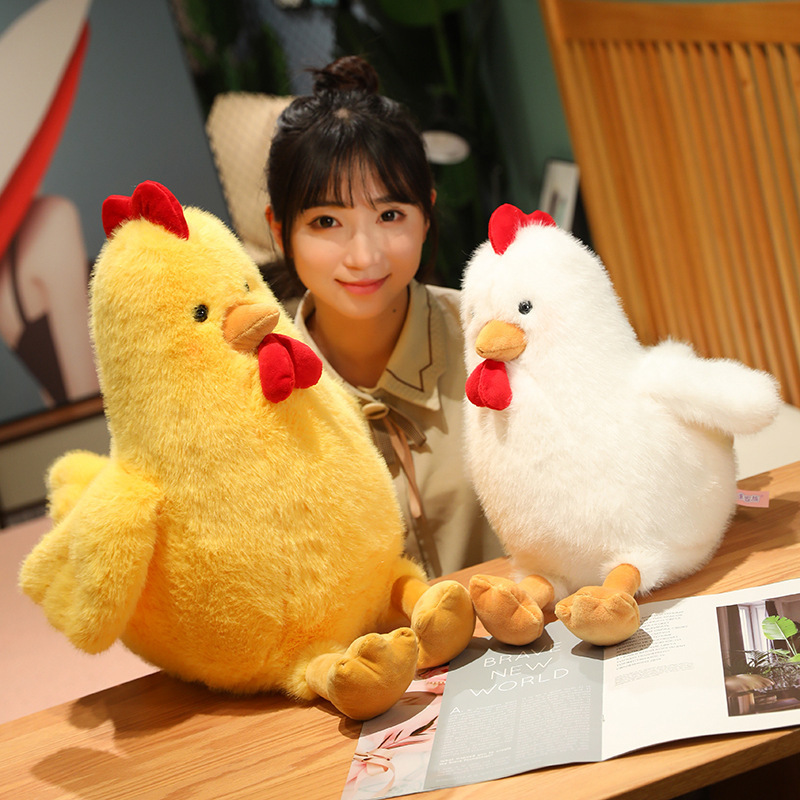 Yellow and White Cute Chicken Plush Toys displayed on a desk, adding soft comfort and charming decor to cozy spaces