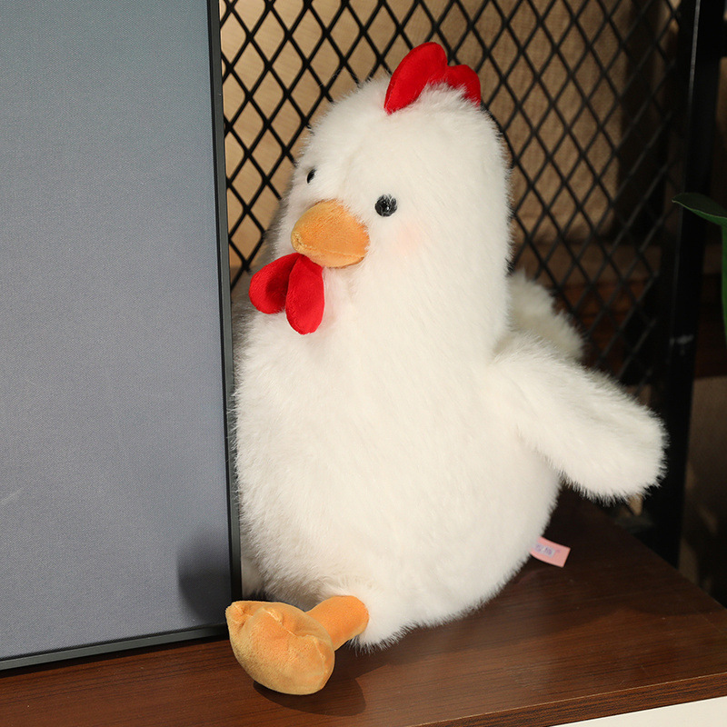 White Cute Chicken Plush Toy displayed on a shelf, featuring fluffy plush fabric and a charming chicken design