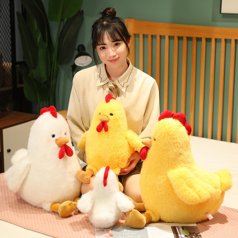 Cute Chicken Plush Toys in white and yellow displayed on a bed, perfect for cuddling and cozy room decor