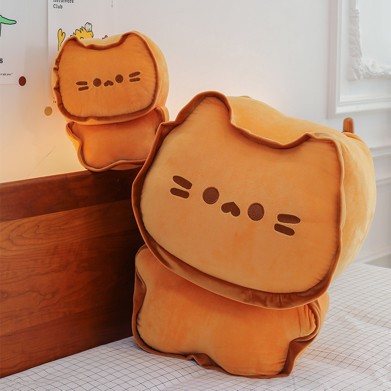 Biscuit Cat Plush Pillow displayed in two sizes on a bed, featuring a cute biscuit-inspired cat design and soft plush fabric for hugging, lounging, and cozy bedroom decor