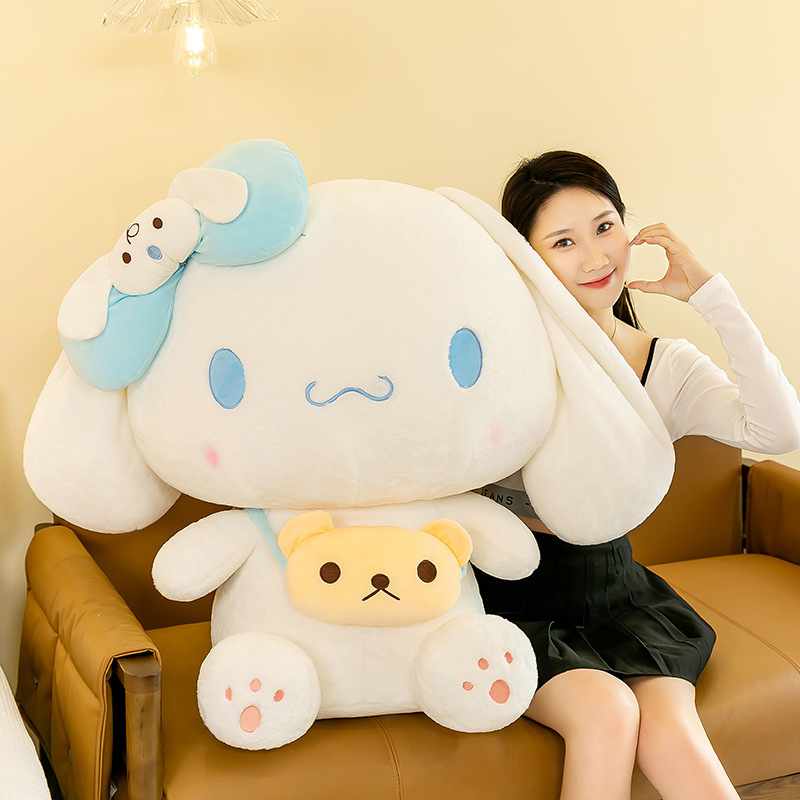 Cinnamoroll plush toy with a mini crossbody bag displayed on a sofa, showcasing its soft plush fabric and cozy design for hugging, displaying, and decorating bedrooms and living spaces