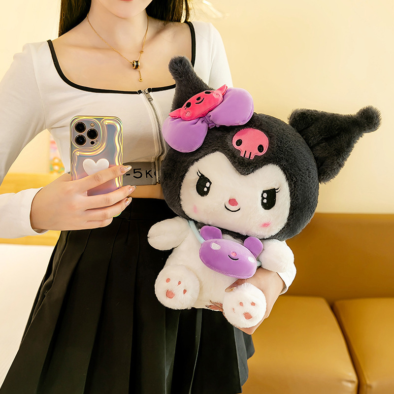 Kuromi plush toy with a mini crossbody bag being held to highlight its embroidered details, soft plush fabric, and adorable character design