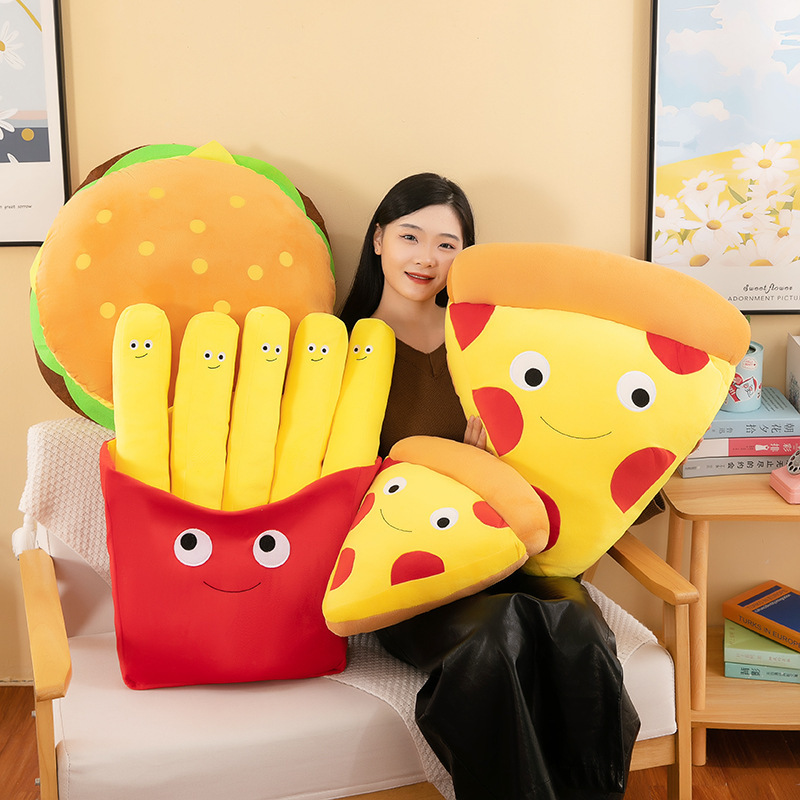 Burger, French Fries & Pizza Plush Toys displayed together on a cozy chair, featuring cute food-inspired designs for hugging, decorating, and gifting