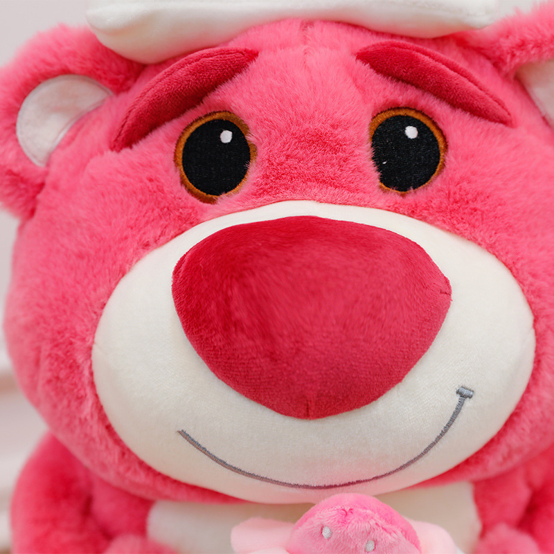 Close-up of the Pink Bear Plush Toy featuring embroidered eyes, a soft plush nose, and a smiling facial expression