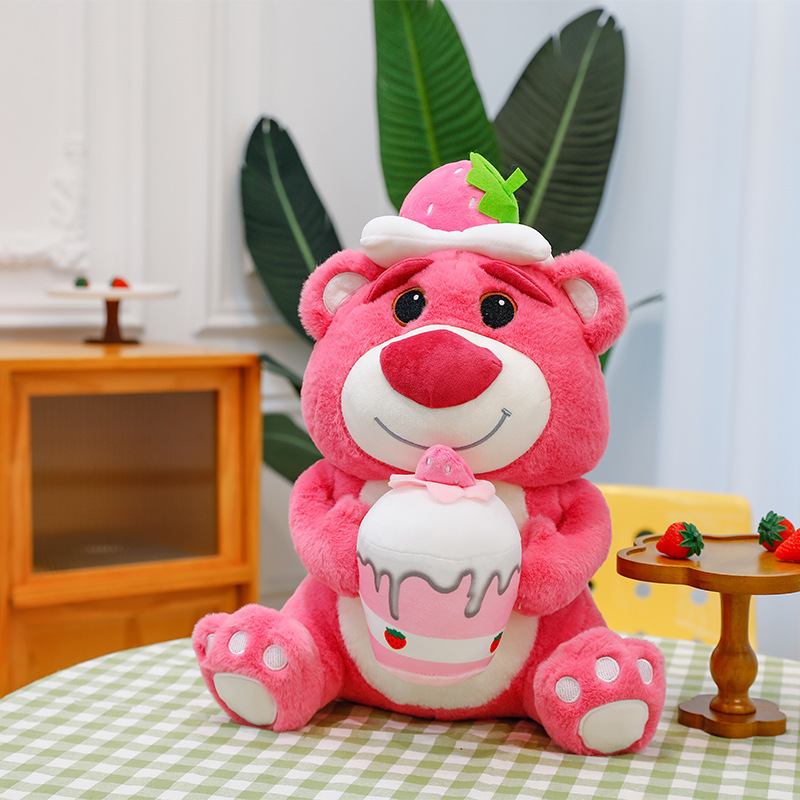 Pink Bear Plush Toy in Strawberry Cake style featuring a smiling bear design, strawberry cake accessory, and soft plush fabric for cuddling or display