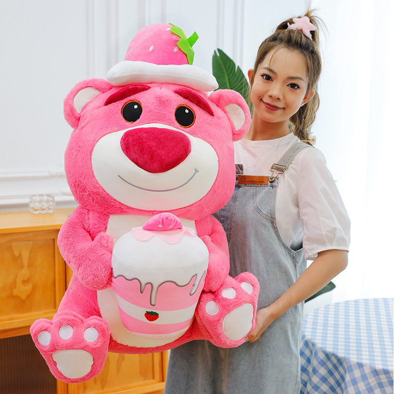 Pink Bear Plush Toy in Strawberry Cake style featuring a smiling bear design, strawberry hat, and soft plush fabric, perfect for cozy bedroom decor