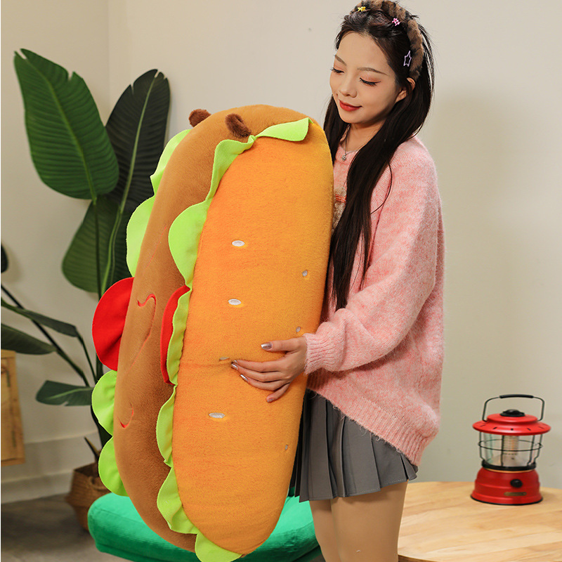 Hot Dog Capybara Plush Pillow showcasing its long body shape, playful hot dog-inspired design, and soft plush texture from a side view