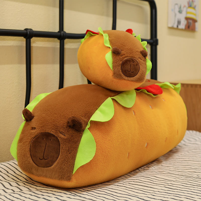 Hot Dog Capybara Plush Pillow displayed in two sizes, featuring a playful food-inspired design, soft plush fabric, and adorable capybara details