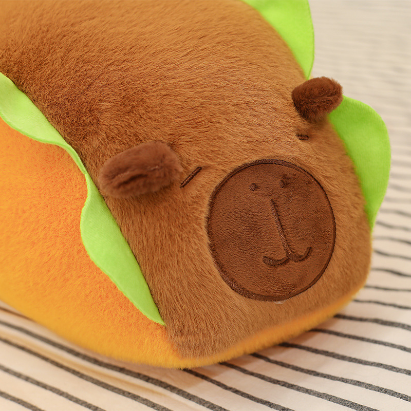 Close-up of the Hot Dog Capybara Plush Pillow highlighting its embroidered capybara face, soft plush fabric, and cute handcrafted details