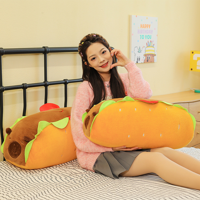Hot Dog Capybara Plush Pillow resting on a bed, featuring soft plush fabric, adorable capybara details, and a playful design that adds warmth to cozy living spaces