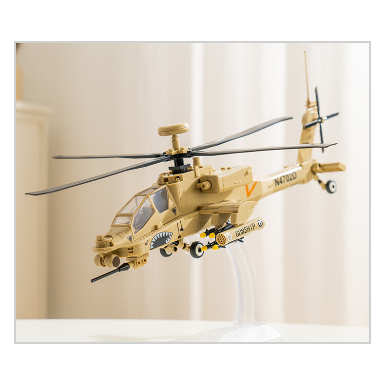 WANGE AH-64 Apache helicopter building blocks model displayed on a clear stand, showcasing the aircraft in a dynamic flight pose with realistic rotor, cockpit, and weapon pod details