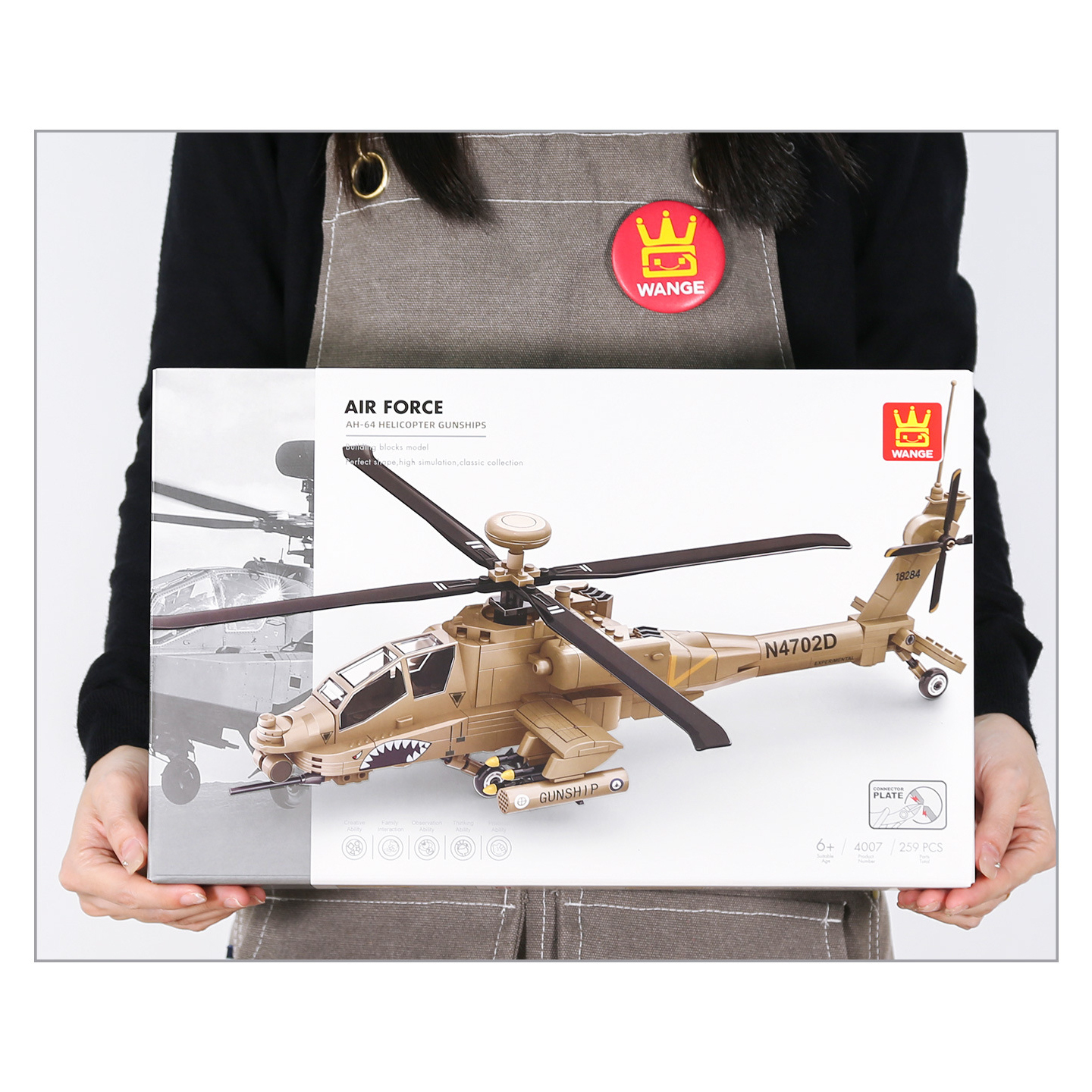 WANGE AH-64 Apache Helicopter Building Blocks retail box shown for package size reference, featuring the completed helicopter model artwork and 259-piece building set