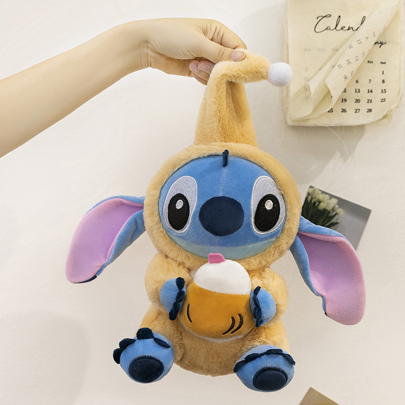 Stitch Costume Plush Toy in the Coconut Drink style with soft plush fabric, embroidered facial details, and a plush coconut drink accessory, shown hanging to display its size