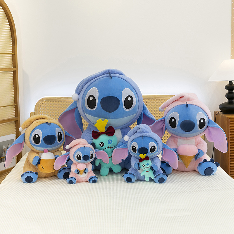 Stitch Costume Plush Toys in Scrump, Coconut Drink, and Ice Cream styles displayed on a bed in a cozy bedroom, showcasing multiple sizes for cuddling, decorating, and collecting