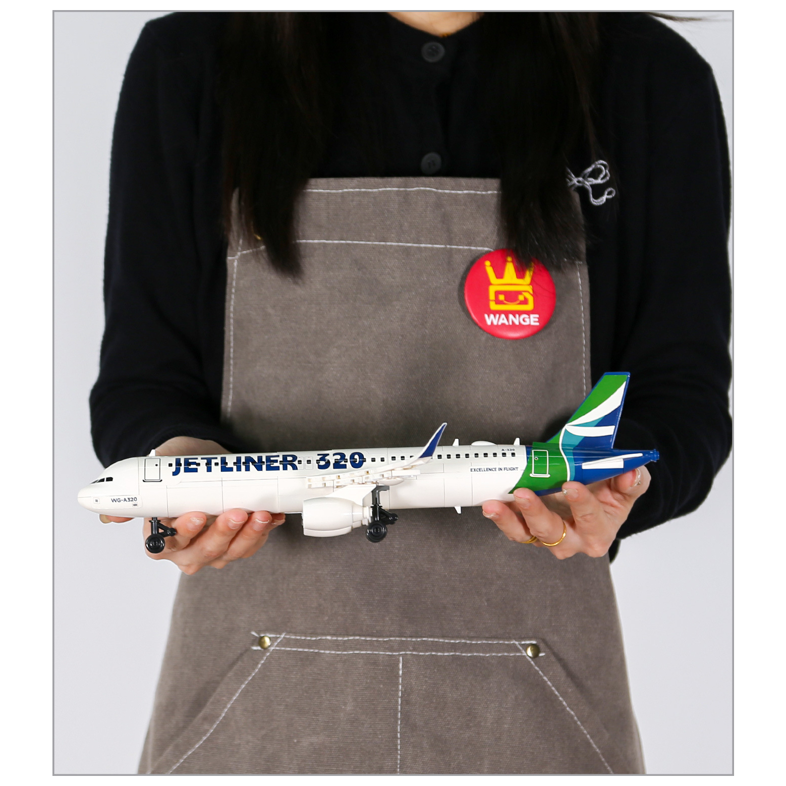 WANGE Jetliner 320 building blocks commercial airliner model shown for assembled size reference, highlighting the streamlined fuselage, twin engines, landing gear, and realistic aircraft details