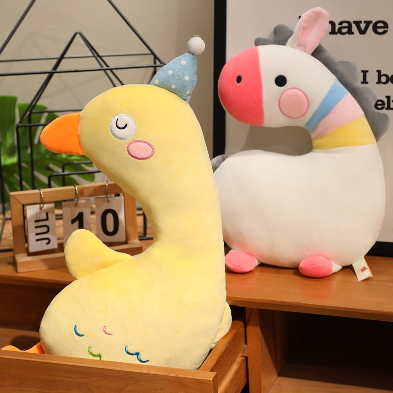Yellow Duck and White Zebra Plush Pillows displayed together, featuring soft plush fabric and playful animal designs for home decor and relaxing